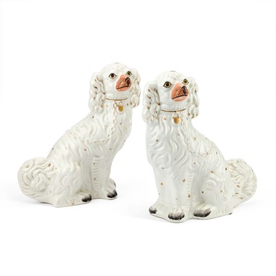 Lot 35 - A PAIR OF VICTORIAN STAFFORDSHIRE POTTERY MODELS OF SEATED SPANIELS