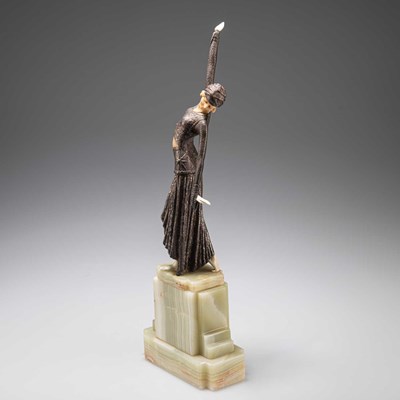 Lot 204 - AN ART DECO BRONZE AND FAUX IVORY FIGURE