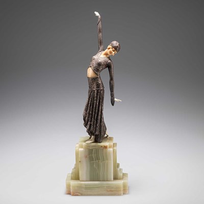Lot 204 - AN ART DECO BRONZE AND FAUX IVORY FIGURE