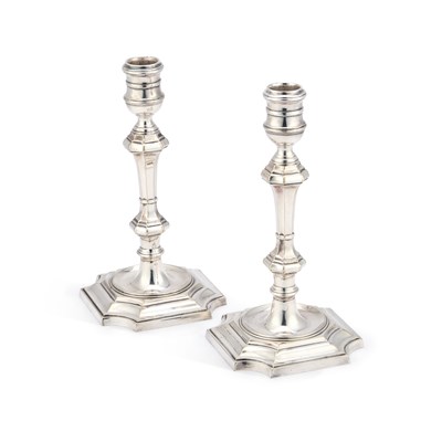 Lot 259 - A PAIR OF GEORGE II STYLE SILVER-PLATED CANDLESTICKS