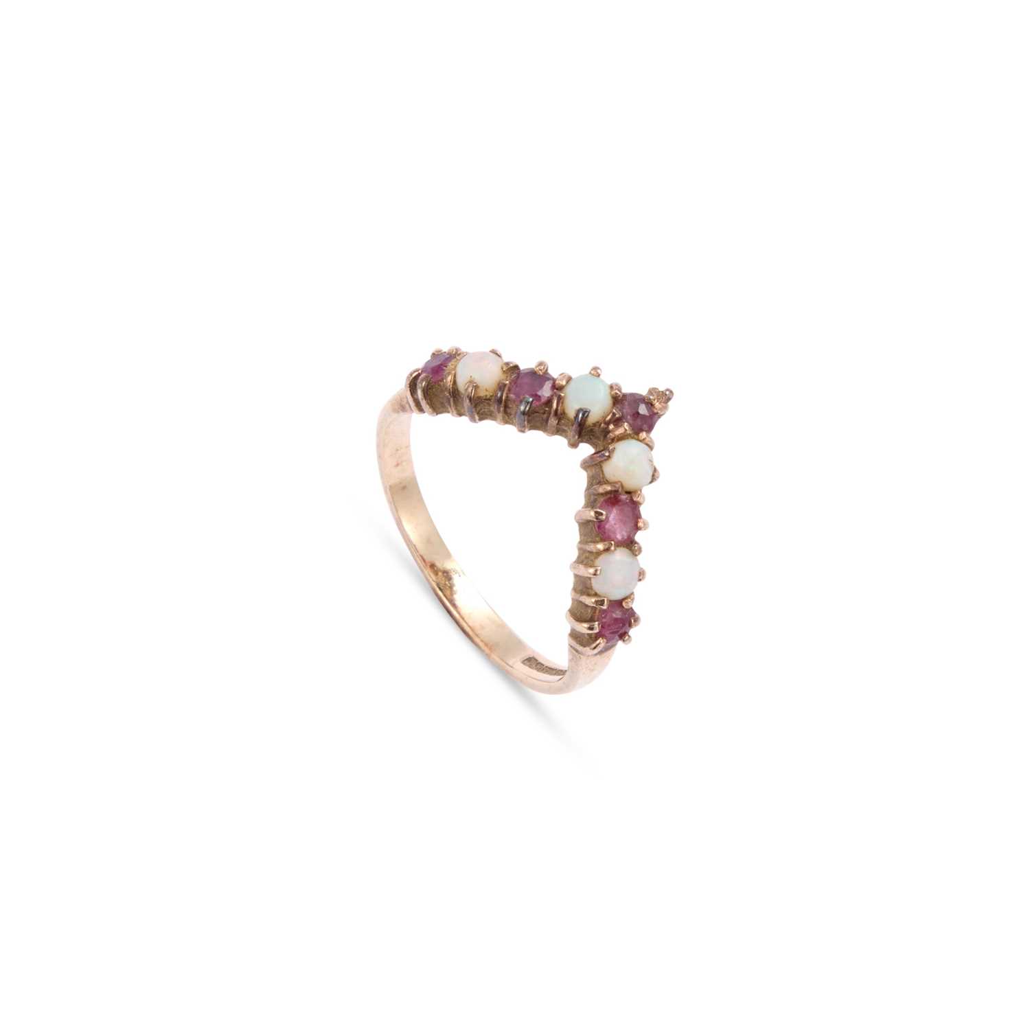 Lot 607 - A 9 CARAT GOLD RUBY AND OPAL WISHBONE RING