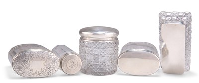 Lot 1397 - FIVE VARIOUS SILVER-LIDDED GLASS DRESSING TABLE JARS, VICTORIAN AND LATER