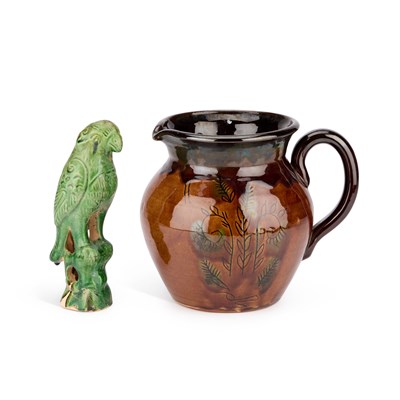 Lot 190 - A CHINESE GREEN-GLAZED MODEL OF A PARROT AND A BROWN-GLAZED POTTERY JUG