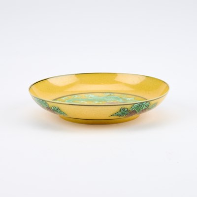 Lot 111 - A CHINESE YELLOW-GROUND 'DRAGON' DISH