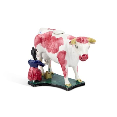 Lot 69 - AN ENGLISH POTTERY COW CREAMER, CIRCA 1830