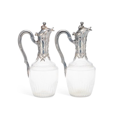 Lot 317 - A PAIR OF FRENCH SILVER-MOUNTED CUT-GLASS CLARET JUGS