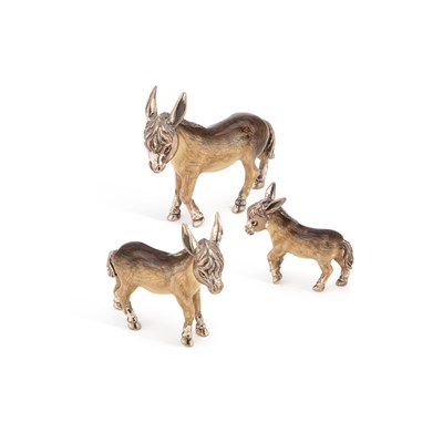 Lot 319 - A SET OF THREE ITALIAN SILVER AND ENAMEL MODELS OF DONKEYS