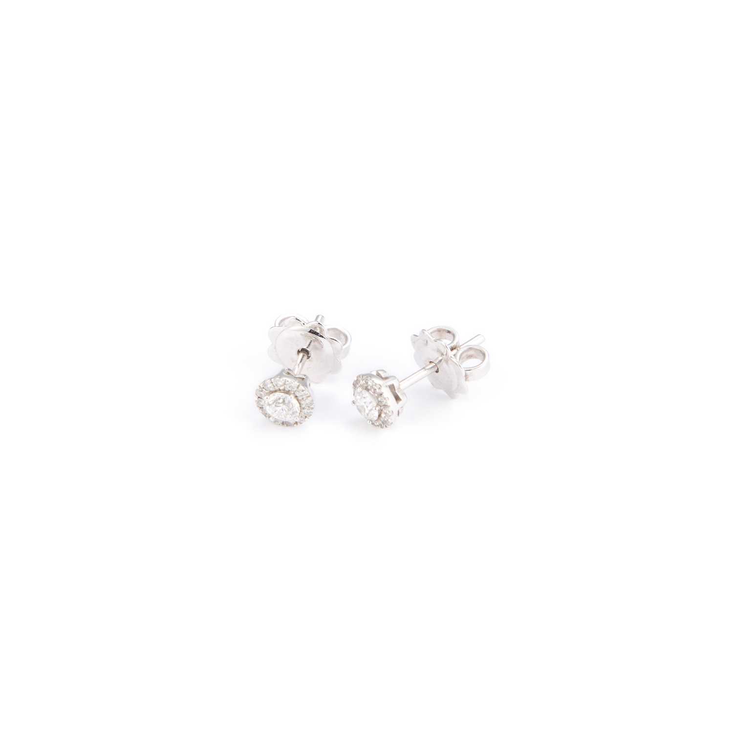 Lot 695 - A PAIR OF 18 CARAT WHITE GOLD DIAMOND CLUSTER STUD EARRINGS