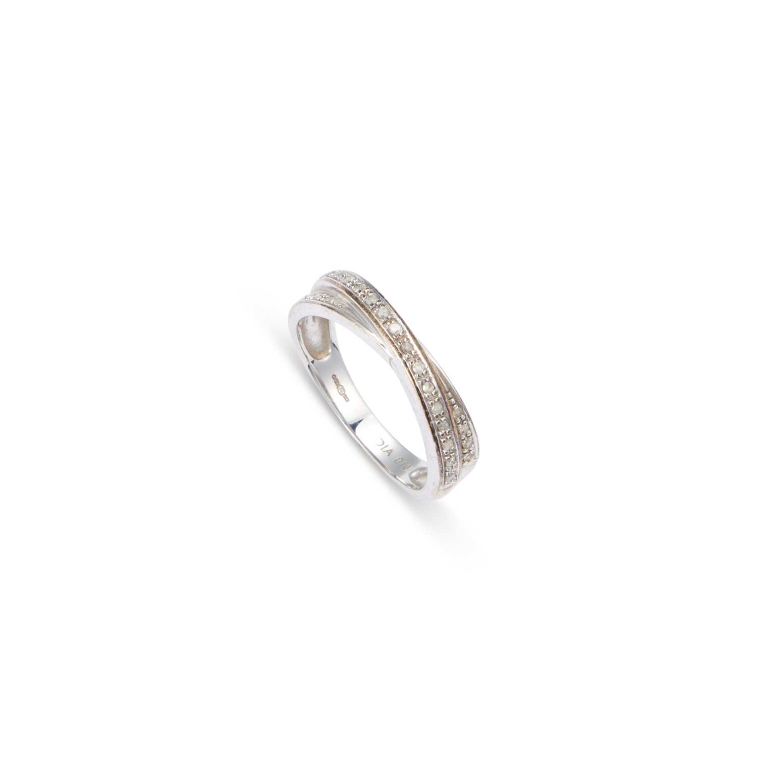 Lot 772 - A 9 CARAT WHITE GOLD DIAMOND HALF HOOP RING