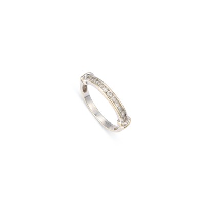 Lot 709 - A 9 CARAT WHITE GOLD DIAMOND HALF HOOP RING