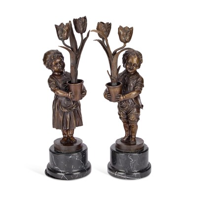 Lot 935 - A PAIR OF PATINATED BRONZE FIGURAL CANDLESTICKS