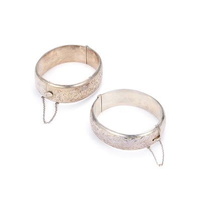 Lot 744 - TWO SILVER FOLIATE ENGRAVED HINGE OPENING BANGLES