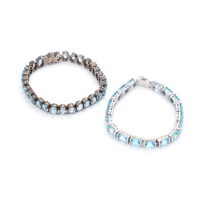 Lot 731 - TWO BLUE TOPAZ LINE BRACELETS