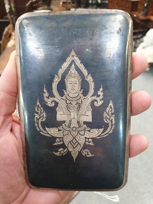 Lot 386 - A THAI STERLING SILVER NIELLO CIGARETTE CASE