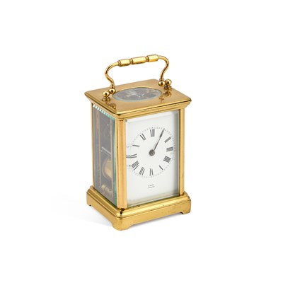 Lot 1002 - A SMALL BRASS-CASED CARRIAGE CLOCK