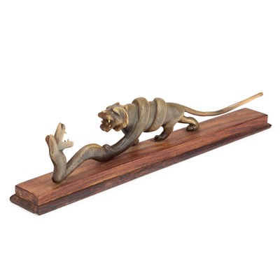 Lot 190 - A 19TH CENTURY ANGLO-INDIAN CARVED RHINOCEROS HORN MODEL OF A TIGER AND A SNAKE