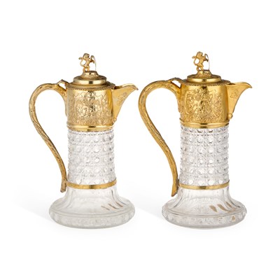 Lot 497 - A PAIR OF VICTORIAN SILVER-GILT MOUNTED CUT-GLASS CLARET JUGS