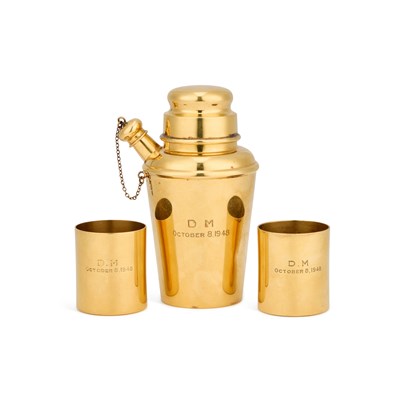 Lot 313 - CARTIER: A 20TH CENTURY STERLING SILVER-GILT COCKTAIL SHAKER AND A PAIR OF BEAKERS