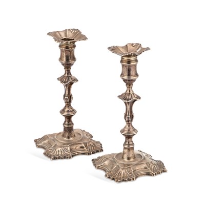 Lot 523 - A PAIR OF EARLY GEORGE III CAST SILVER CANDLESTICKS