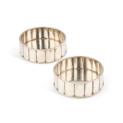 Lot 365 - A PAIR OF MODERNIST SILVER WINE COASTERS