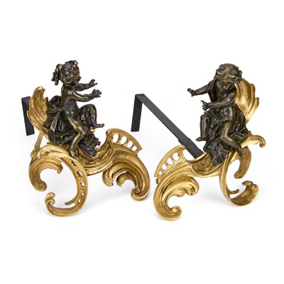 Lot 928 - A PAIR OF FRENCH PATINATED BRONZE AND ORMOLU CHENETS