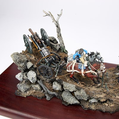Lot 26 - A LARGE MILITARY MODEL OF MOUNTED SOLDIERS PULLING A CANNON