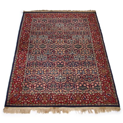 Lot 972 - A TURKISH HEREKE WOOL CARPET