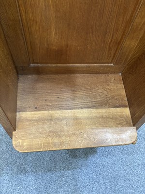 Lot 1157 - ROBERT THOMPSON OF KILBURN, A MOUSEMAN OAK WING-BACK HALL SEAT
