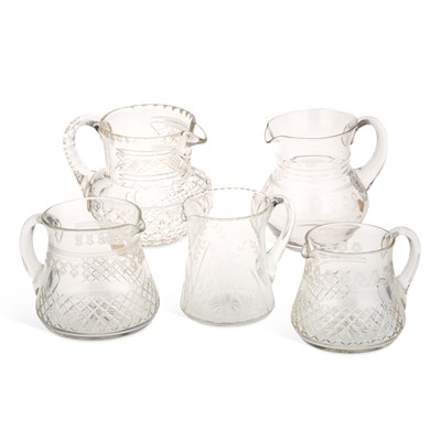 Lot 41 - A GROUP OF FIVE EARLY 20TH CENTURY ETCHED AND CUT-GLASS JUGS