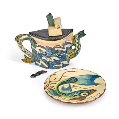 Lot 69 - AN ART POTTERY 'FISH' PLATE AND A NOVELTY TEAPOT