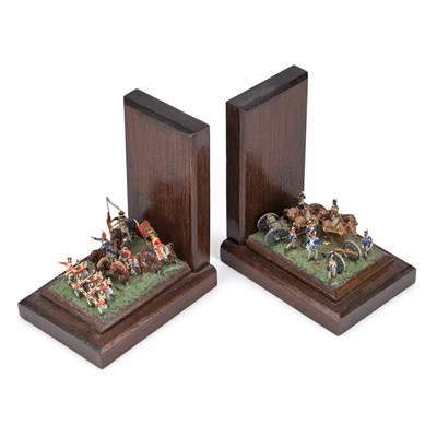 Lot 13 - A PAIR OF PAINTED LEAD AND OAK 'TOY SOLDIERS' BOOKENDS