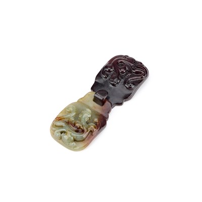 Lot 258 - A CHINESE CARVED JADE BELT BUCKLE