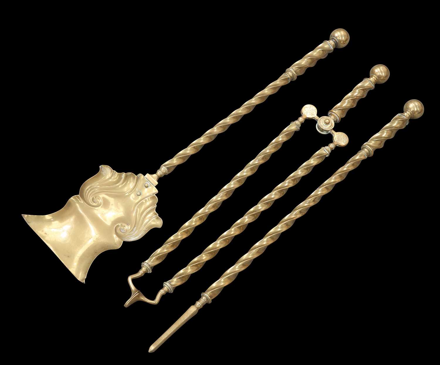 Lot 22 A SET OF THREE VICTORIAN BRASS FIRE IRONS