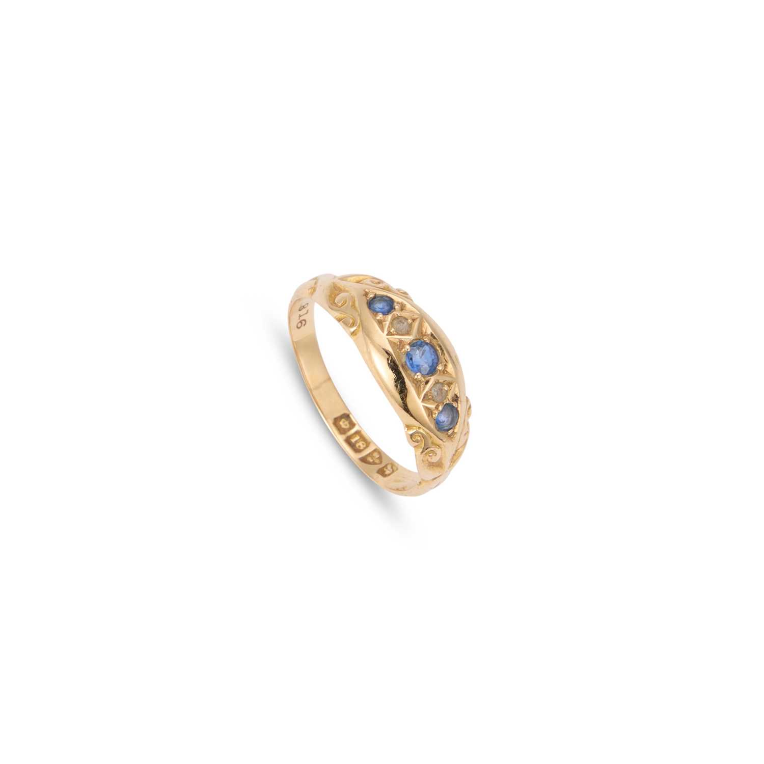 Lot AN 18 CARAT GOLD SAPPHIRE AND DIAMOND RING