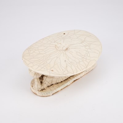 Lot 209 - A CHINESE BLANC DE CHINE CRACKLE GLAZE PILLOW