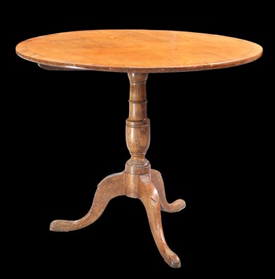 Lot 333 - A GEORGE III MAHOGANY-CROSSBANDED OAK TILT-TOP TRIPOD TABLE