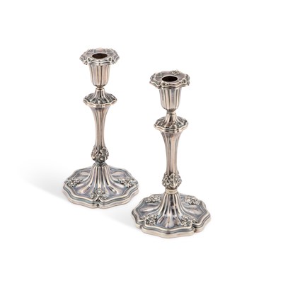 Lot A PAIR OF EARLY VICTORIAN SILVER TAPERSTICKS