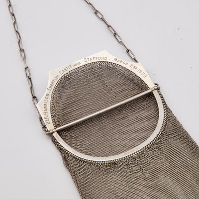 Lot 668 - A GEORGE V SILVER AND ENAMEL MESH PURSE