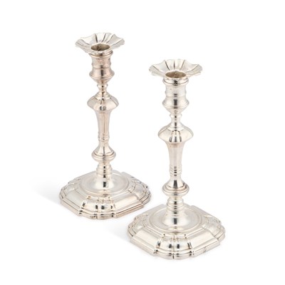 Lot A PAIR OF GEORGE II CAST SILVER CANDLESTICKS