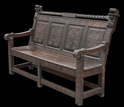 Lot 59 - A VICTORIAN CARVED OAK SETTLE