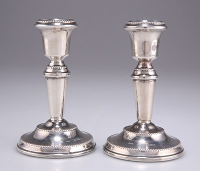 Lot 1494 - A PAIR OF ELIZABETH II SILVER CANDLESTICKS