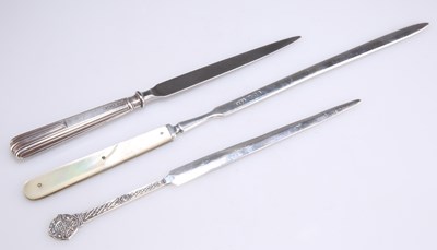 Lot 1466 - THREE SILVER / SILVER-MOUNTED LETTER OPENERS, 20TH CENTURY