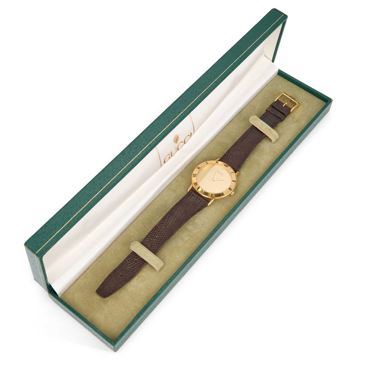 Lot 327 - A GOLD PLATED GUCCI STRAP WATCH