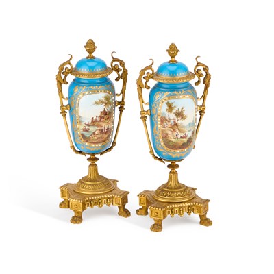 Lot 38 - A PAIR OF GILT-METAL MOUNTED SEVRES STYLE PORCELAIN URNS