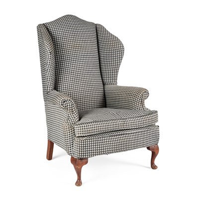 Lot 666 - A LARGE UPHOLSTERED WING-BACK ARMCHAIR