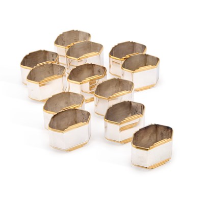 Lot 266 - A SET OF TWELVE MODERN GERMAN STERLING SILVER PARCEL-GILT NAPKIN RINGS