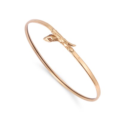 Lot 546 - A GARNET SNAKE BANGLE