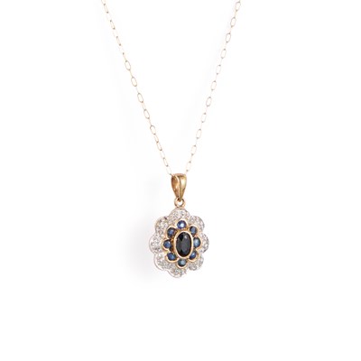 Lot 284 - A 9 CARAT GOLD SAPPHIRE AND DIAMOND CLUSTER PENDANT ON CHAIN