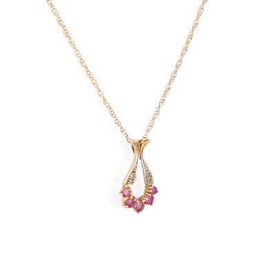 Lot 524 - A 9 CARAT GOLD RUBY AND DIAMOND PENDANT ON CHAIN