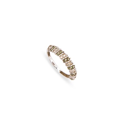 Lot 342 - A 9 CARAT WHITE GOLD GREEN SAPPHIRE AND DIAMOND HALF HOOP RING